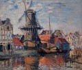El molino de viento en el canal Onbekende Amsterdam 1874 Claude Monet